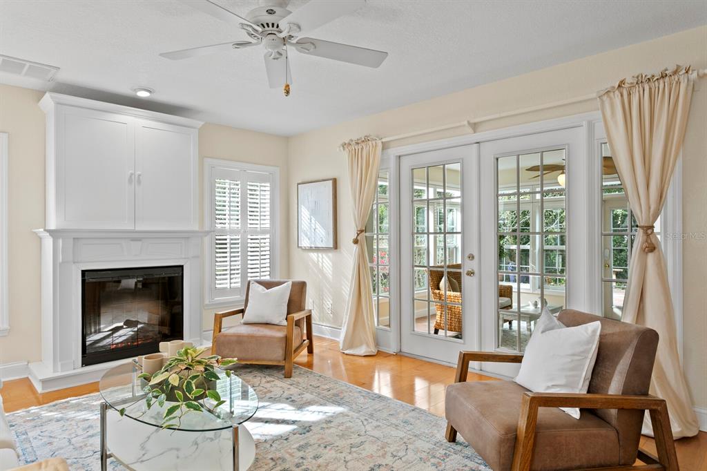 309 Park Ridge Avenue Temple Terrace, FL 33617 - Photo 11 of 60 a living room with furniture and a fireplace