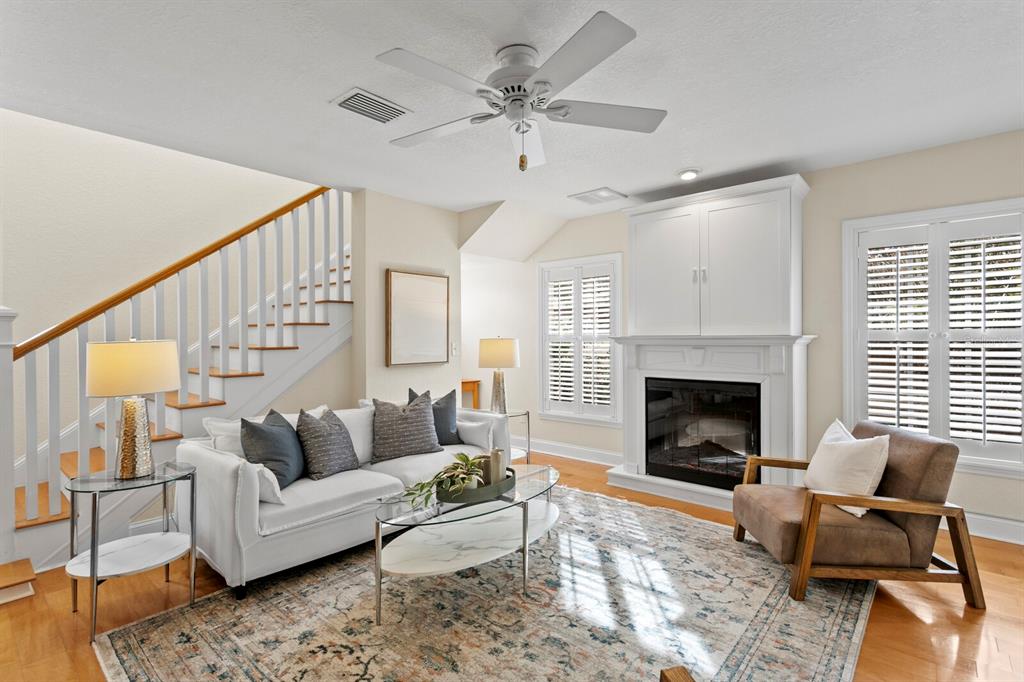 309 Park Ridge Avenue Temple Terrace, FL 33617 - Photo 14 of 60 a living room with furniture and a fireplace