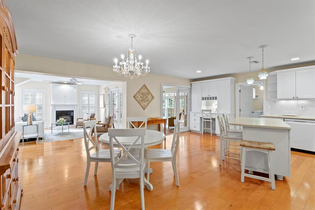 309 Park Ridge Avenue Temple Terrace, FL 33617 - Photo 15 of 60 a view of a dining room and livingroom with furniture wooden floor a chandelier