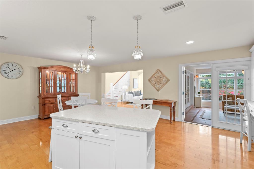 309 Park Ridge Avenue Temple Terrace, FL 33617 - Photo 21 of 60 a view of a kitchen with kitchen island a large window cabinets a sink and stainless steel appliances