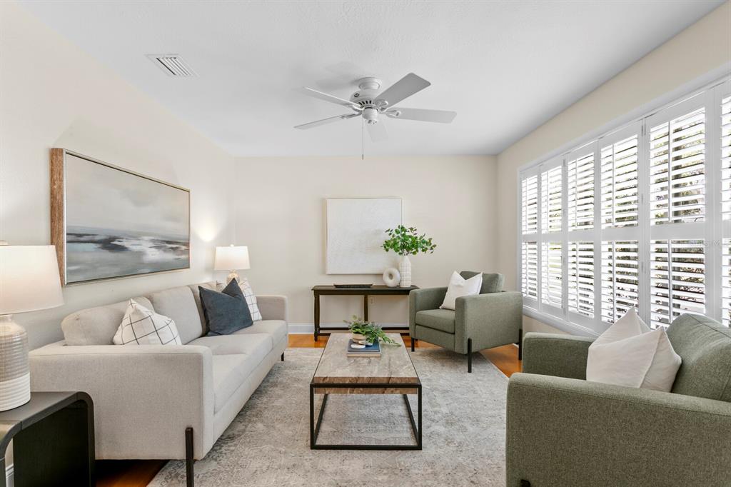 309 Park Ridge Avenue Temple Terrace, FL 33617 - Photo 23 of 60 a living room with furniture and a large window