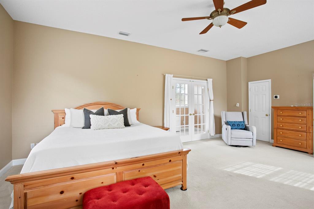 309 Park Ridge Avenue Temple Terrace, FL 33617 - Photo 29 of 60 a bedroom with a bed and gym equipment