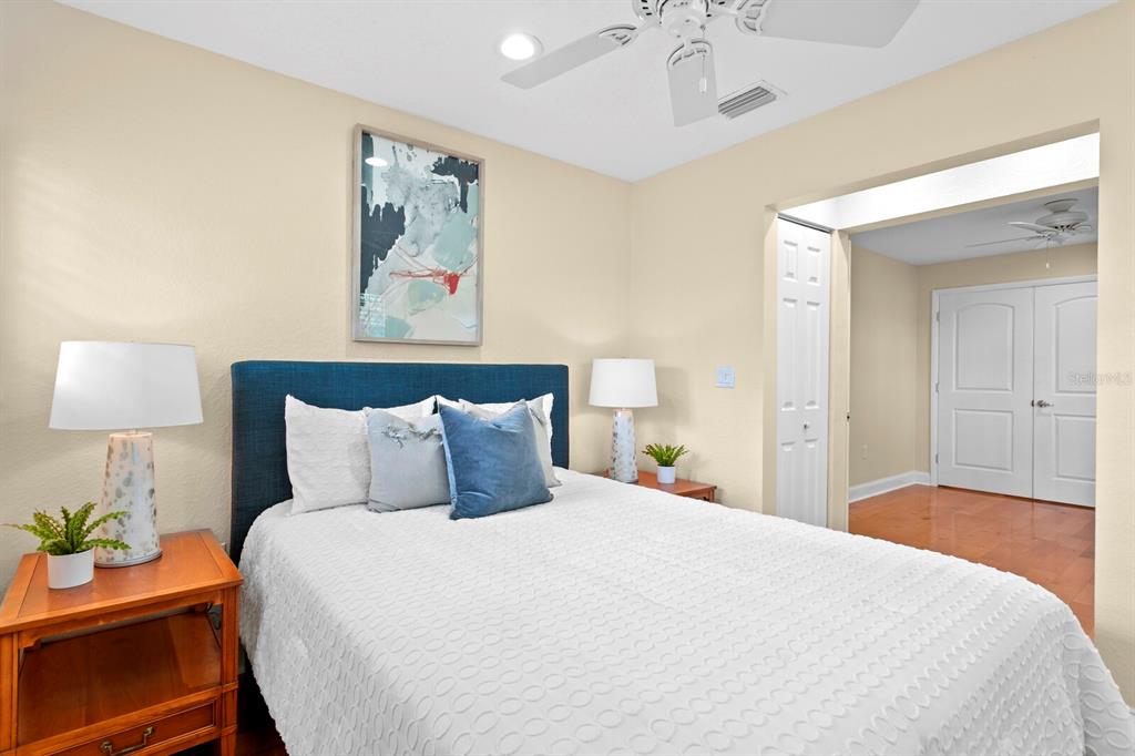 309 Park Ridge Avenue Temple Terrace, FL 33617 - Photo 38 of 60 a bedroom with a bed and a lamp