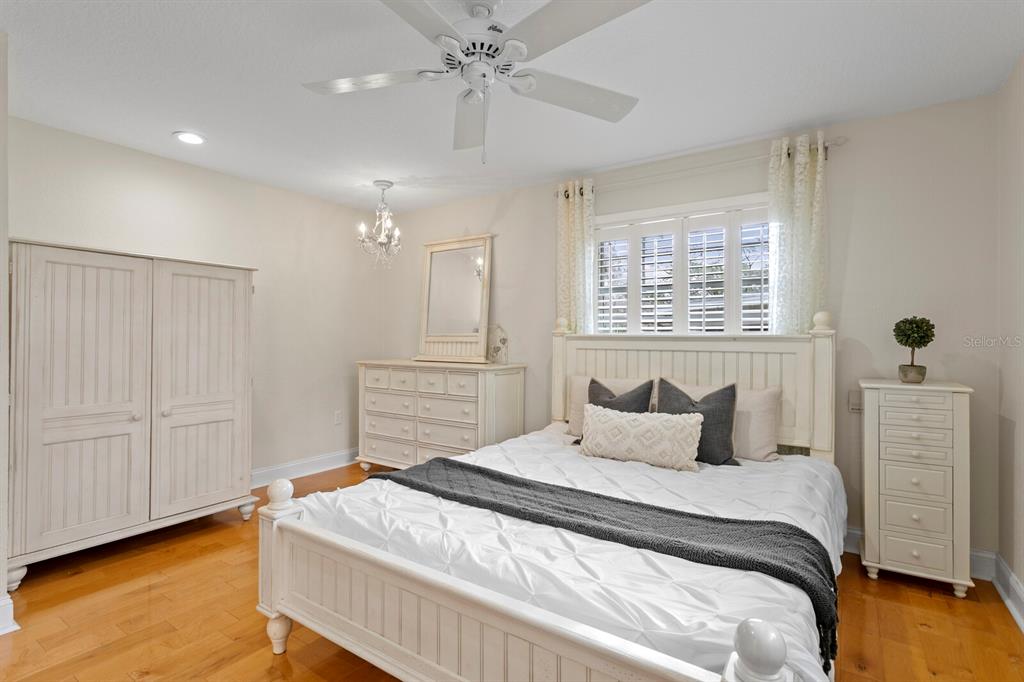 309 Park Ridge Avenue Temple Terrace, FL 33617 - Photo 43 of 60 a bedroom with a bed and a chandelier