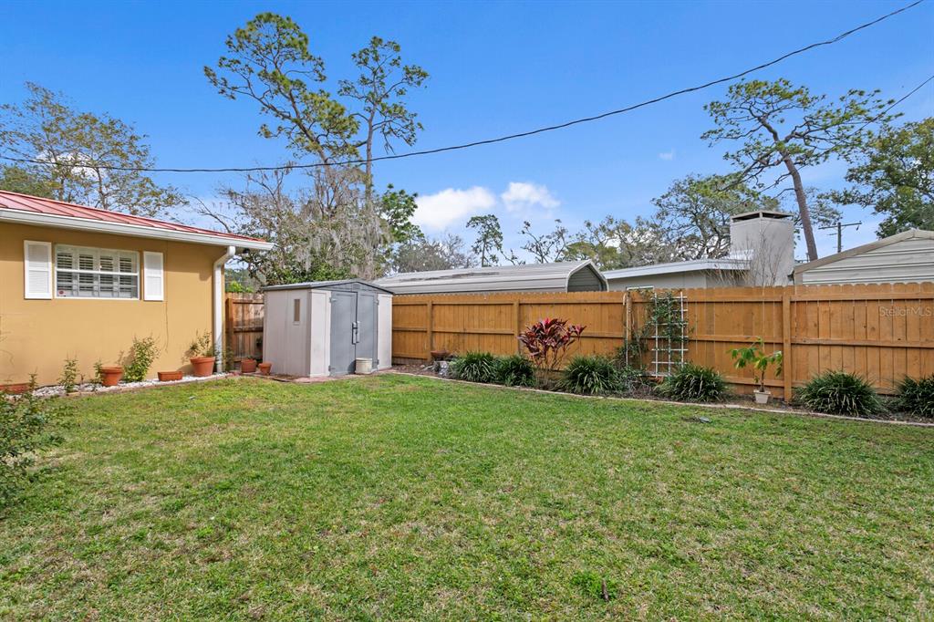 309 Park Ridge Avenue Temple Terrace, FL 33617 - Photo 50 of 60 a house view with a garden space