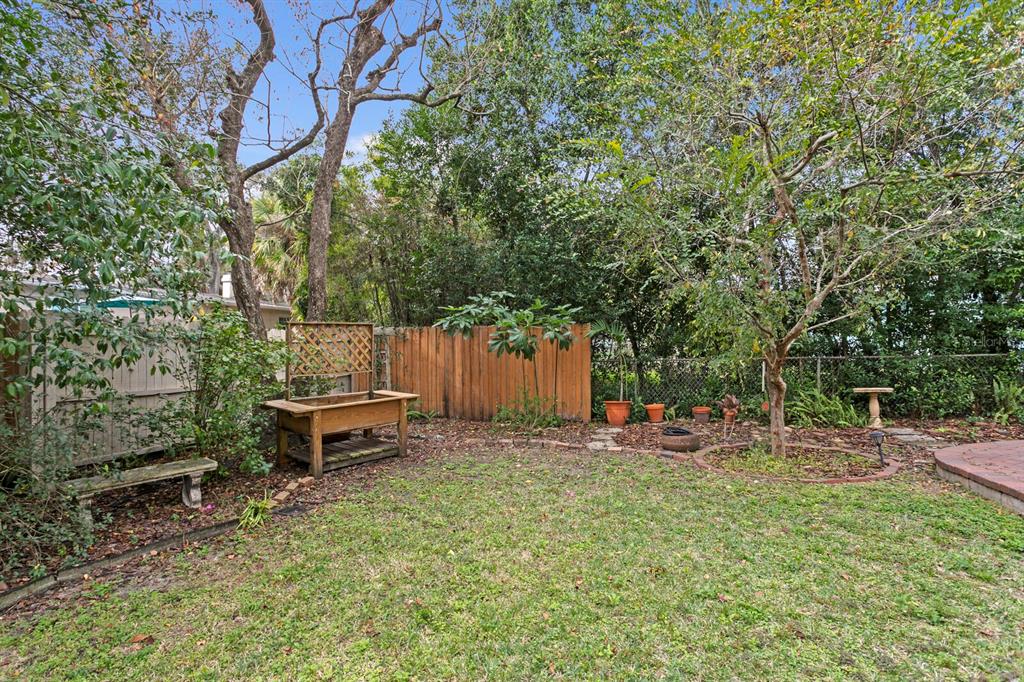 309 Park Ridge Avenue Temple Terrace, FL 33617 - Photo 52 of 60 a backyard of a house with table and chairs