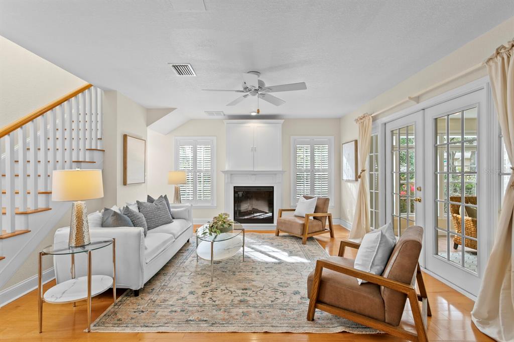 309 Park Ridge Avenue Temple Terrace, FL 33617 - Photo 10 of 60 a living room with furniture and a fireplace