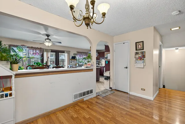 a dining room with furniture a flat screen tv and a large window