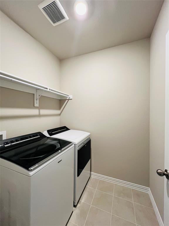 3305 Cross Shr Drive Anna, TX 75409 - Photo 6 of 31 Washroom with washing machine and dryer and light tile patterned flooring