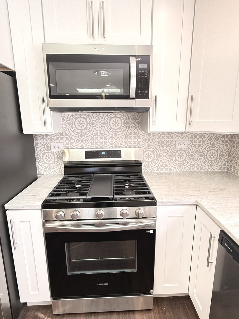 11657 South Racine Avenue Chicago, IL 60643 - Photo 24 of 40 a stove top oven sitting inside of a kitchen