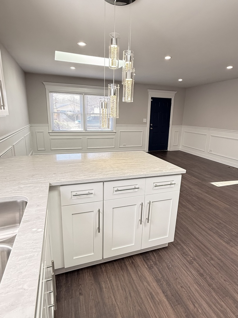 11657 South Racine Avenue Chicago, IL 60643 - Photo 27 of 40 a kitchen with stainless steel appliances granite countertop a white cabinets and wooden floor