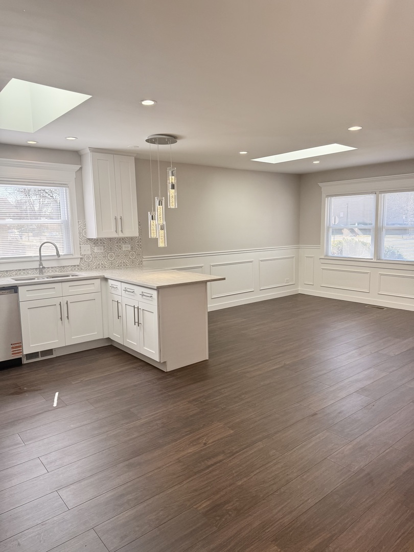 11657 South Racine Avenue Chicago, IL 60643 - Photo 32 of 40 a view of kitchen with wooden floor and window