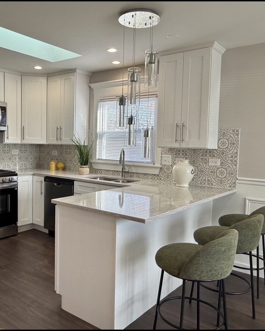 11657 South Racine Avenue Chicago, IL 60643 - Photo 5 of 40 a kitchen with kitchen island granite countertop a sink and cabinets