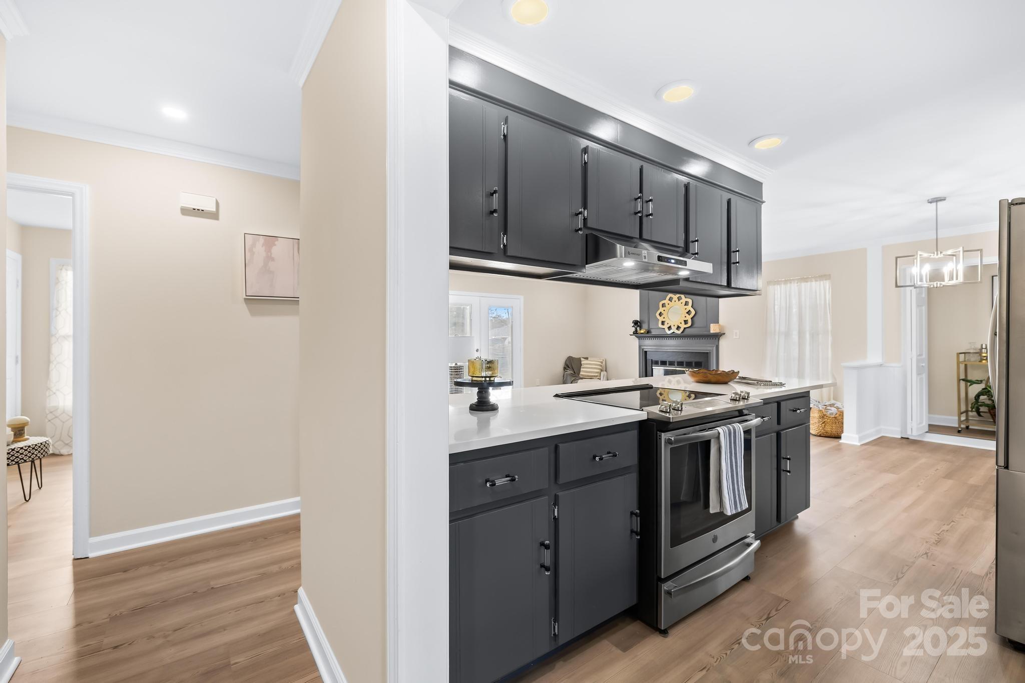 6306 Fox Hunt Road Indian Trail, NC 28079 - Photo 11 of 20 a kitchen with stainless steel appliances granite countertop a stove and a refrigerator