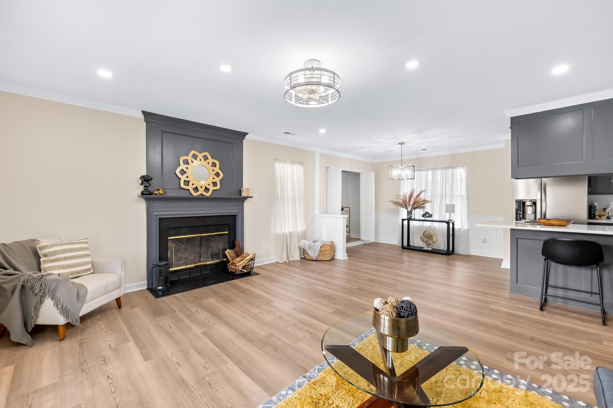 6306 Fox Hunt Road Indian Trail, NC 28079 - Photo 13 of 20 a living room with furniture and a fireplace