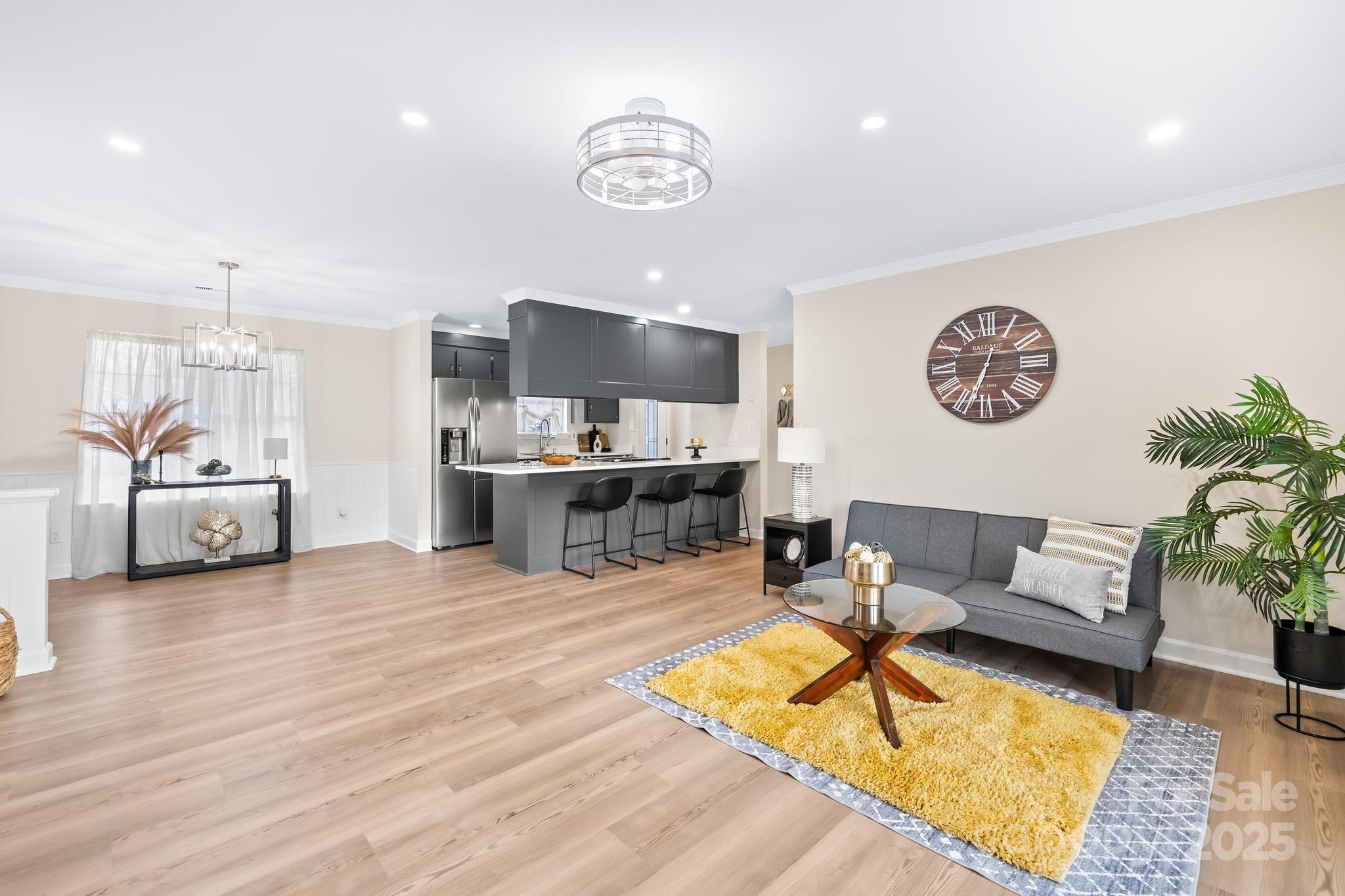 6306 Fox Hunt Road Indian Trail, NC 28079 - Photo 5 of 20 a living room with furniture and a flat screen tv