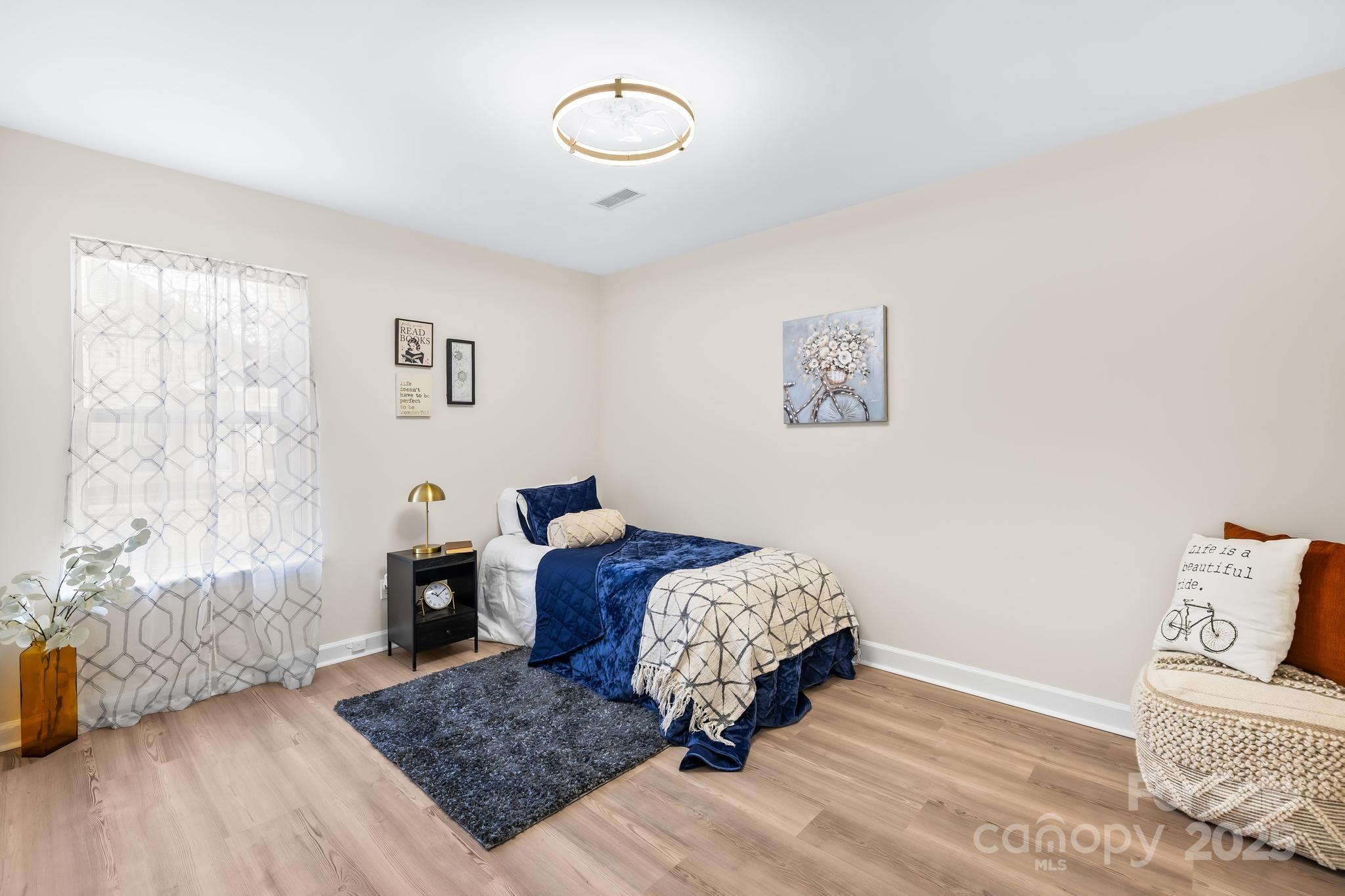 6306 Fox Hunt Road Indian Trail, NC 28079 - Photo 8 of 20 a living room with furniture and a rug