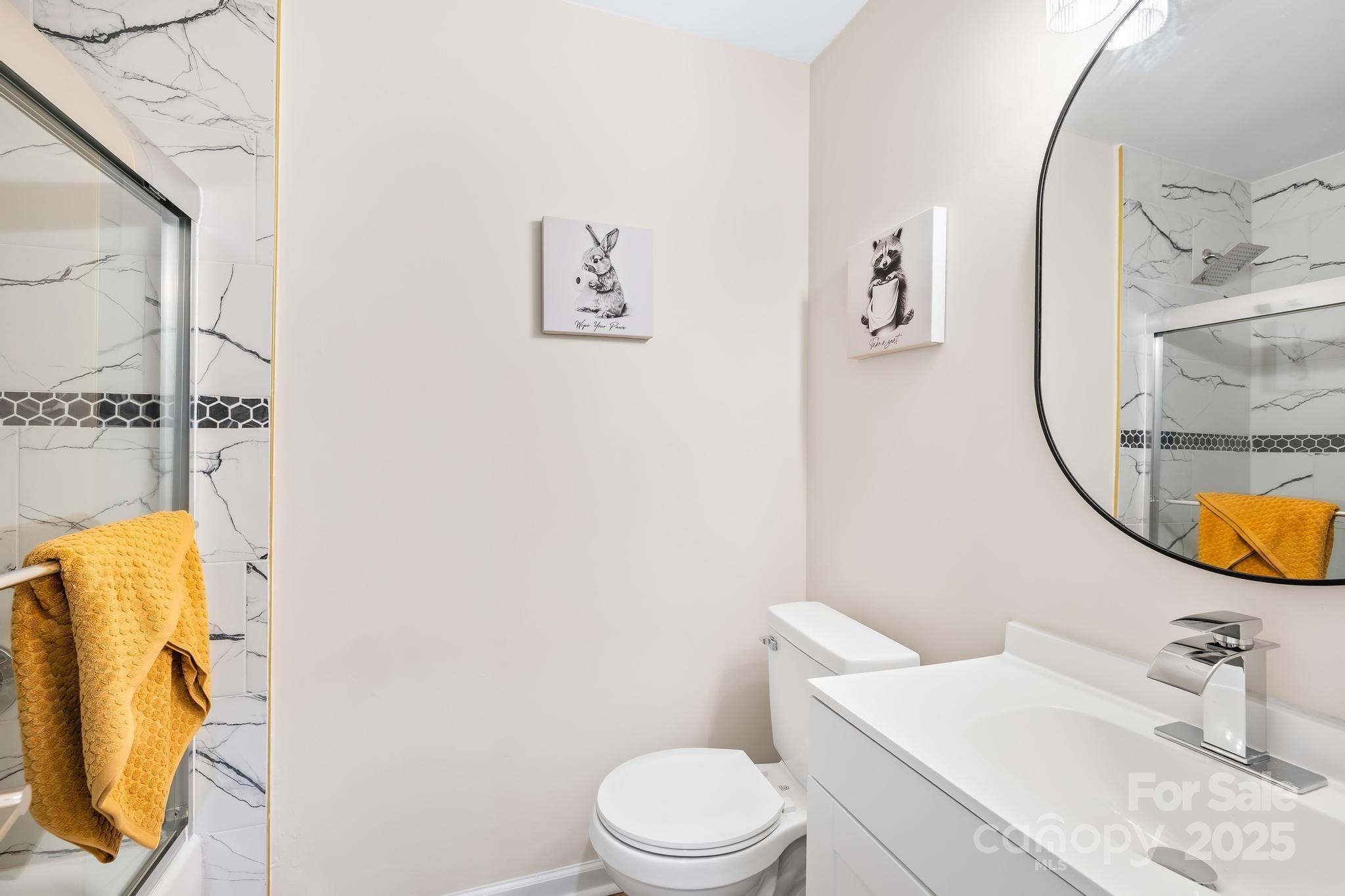 6306 Fox Hunt Road Indian Trail, NC 28079 - Photo 10 of 20 a bathroom with a sink and a mirror