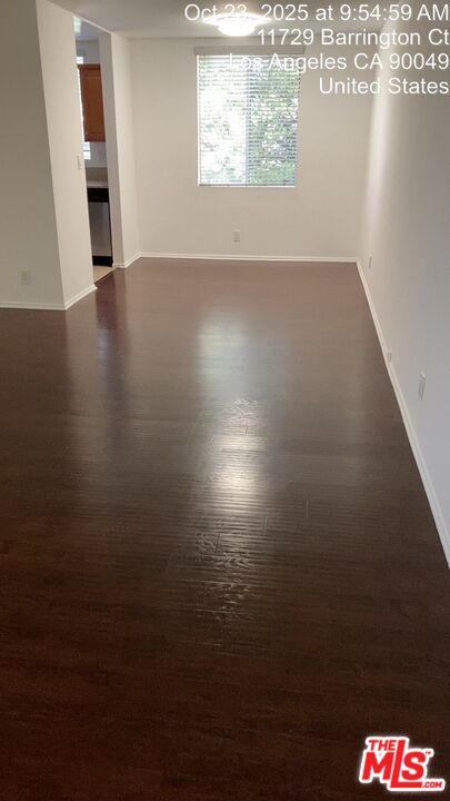 11730 Sunset Boulevard Los Angeles, CA 90049 - Photo 3 of 20 an empty room with wooden floor and windows