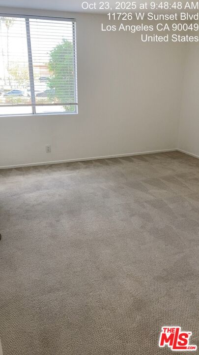 11730 Sunset Boulevard Los Angeles, CA 90049 - Photo 6 of 20 a view of an empty room and a window