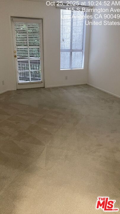 11730 Sunset Boulevard Los Angeles, CA 90049 - Photo 8 of 20 a view of an empty room with a window