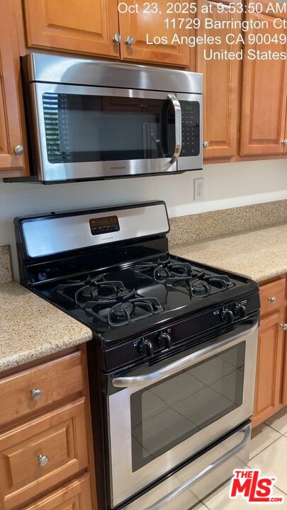 11730 Sunset Boulevard Los Angeles, CA 90049 - Photo 10 of 20 a stove top oven sitting inside of a kitchen