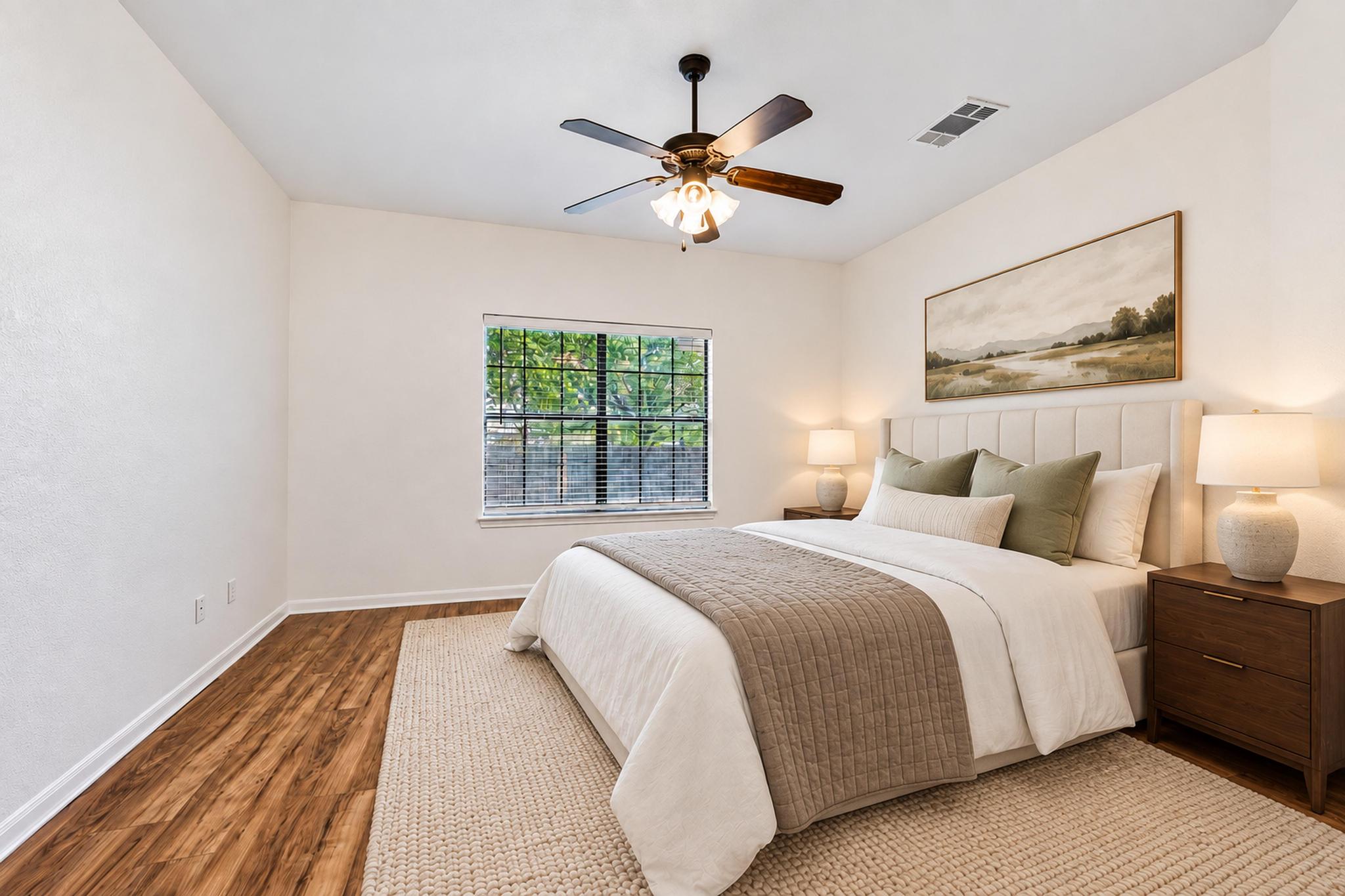 150 Engineers Pass Jarrell, TX 76537 - Photo 28 of 40 Warm wood flooring and natural light create a peaceful and inviting bedroom atmosphere.