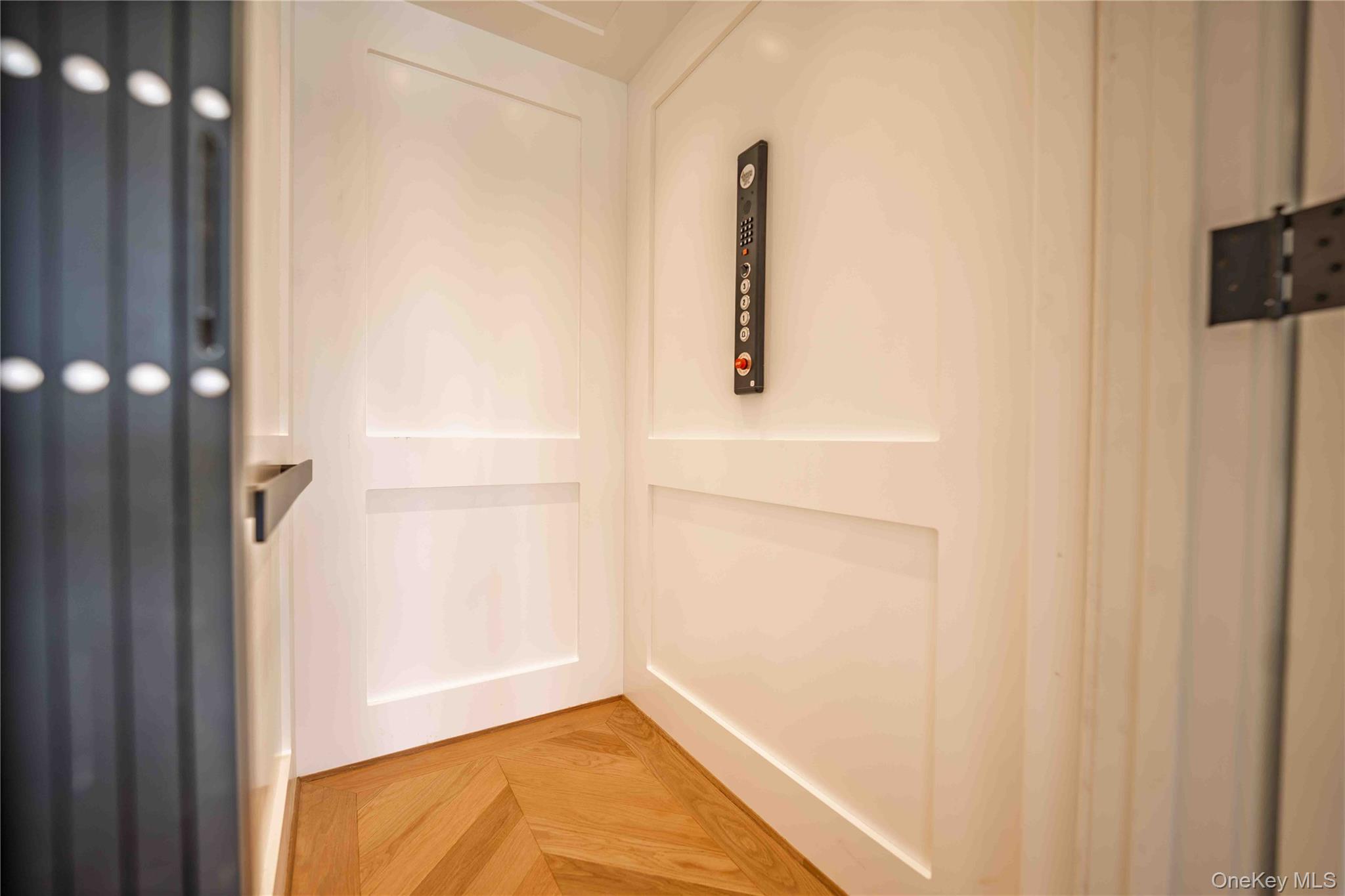 106 Cove Road Asharoken, NY 11768 - Photo 18 of 46 3 Stop elevator with chevron oak flooring