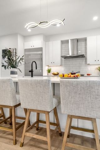 a living room with a couch and wooden floor