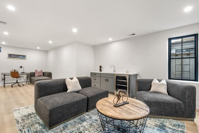a living room with furniture and a table