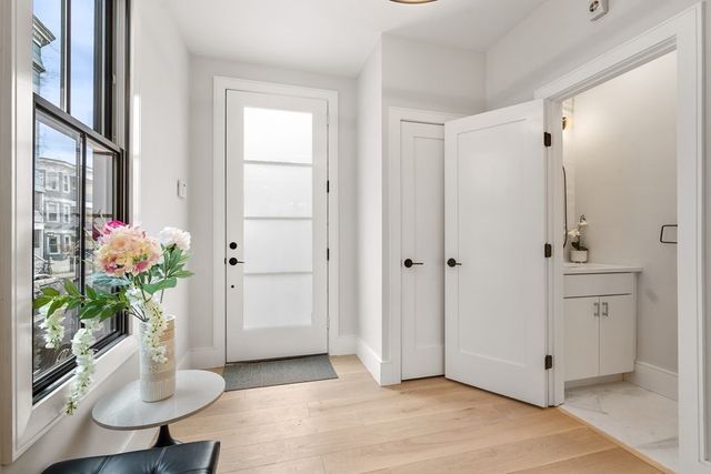 a view of entryway with wooden floor