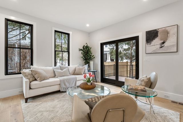 a living room with furniture and window