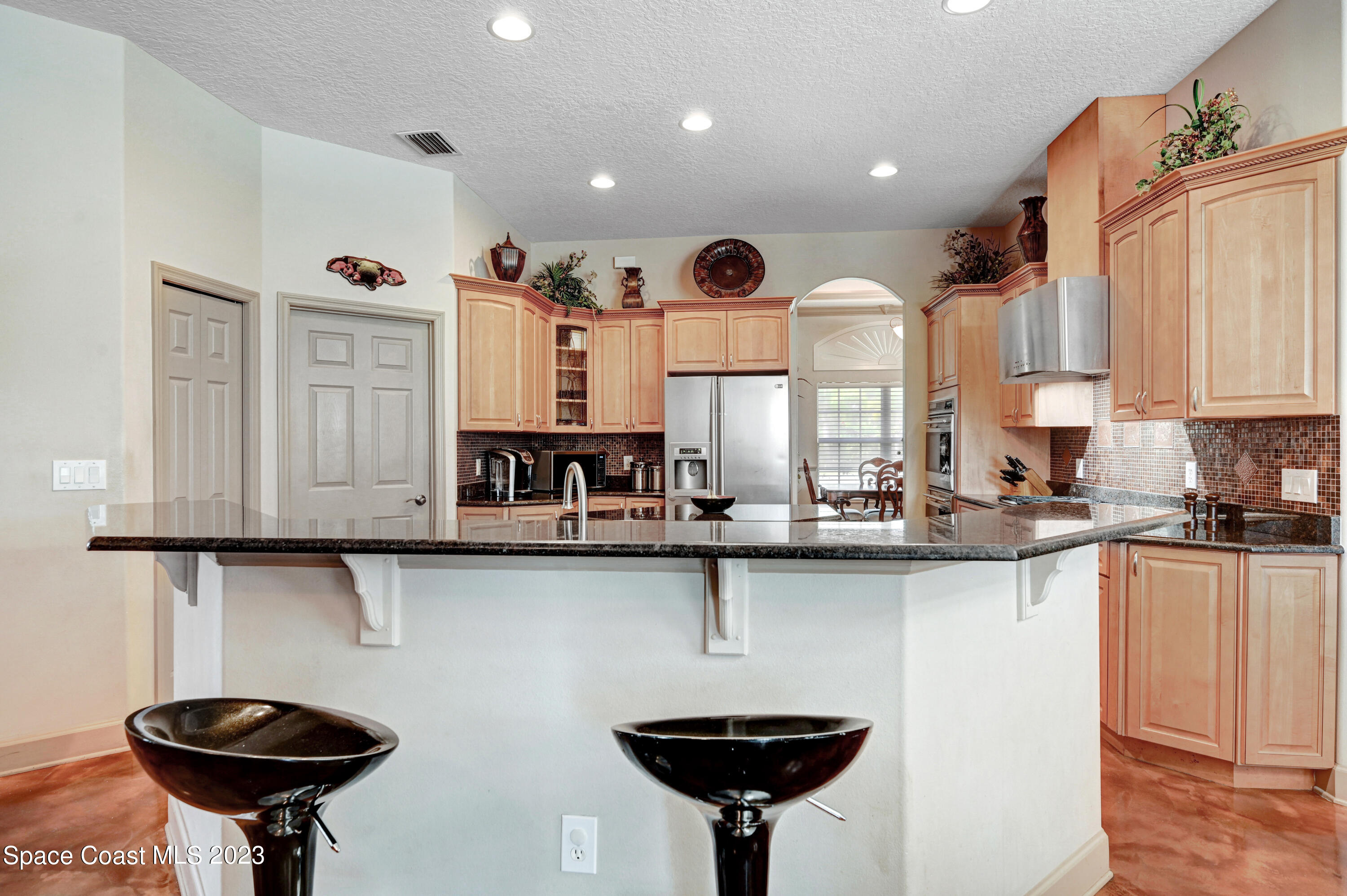 1317 Centennial Way Rockledge, FL 32955 - Photo 11 of 38 a kitchen with stainless steel appliances a sink and cabinets