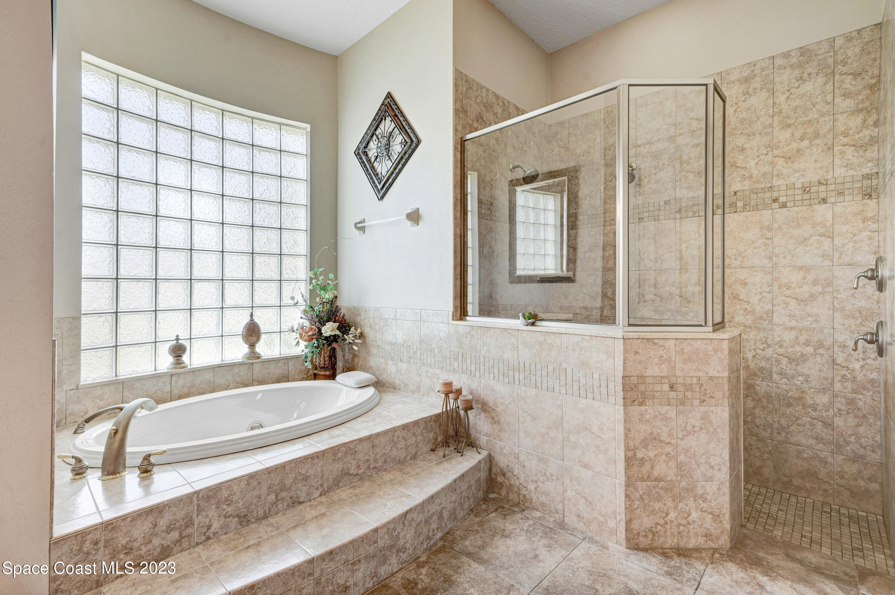1317 Centennial Way Rockledge, FL 32955 - Photo 24 of 38 a bathroom with a bathtub and a shower