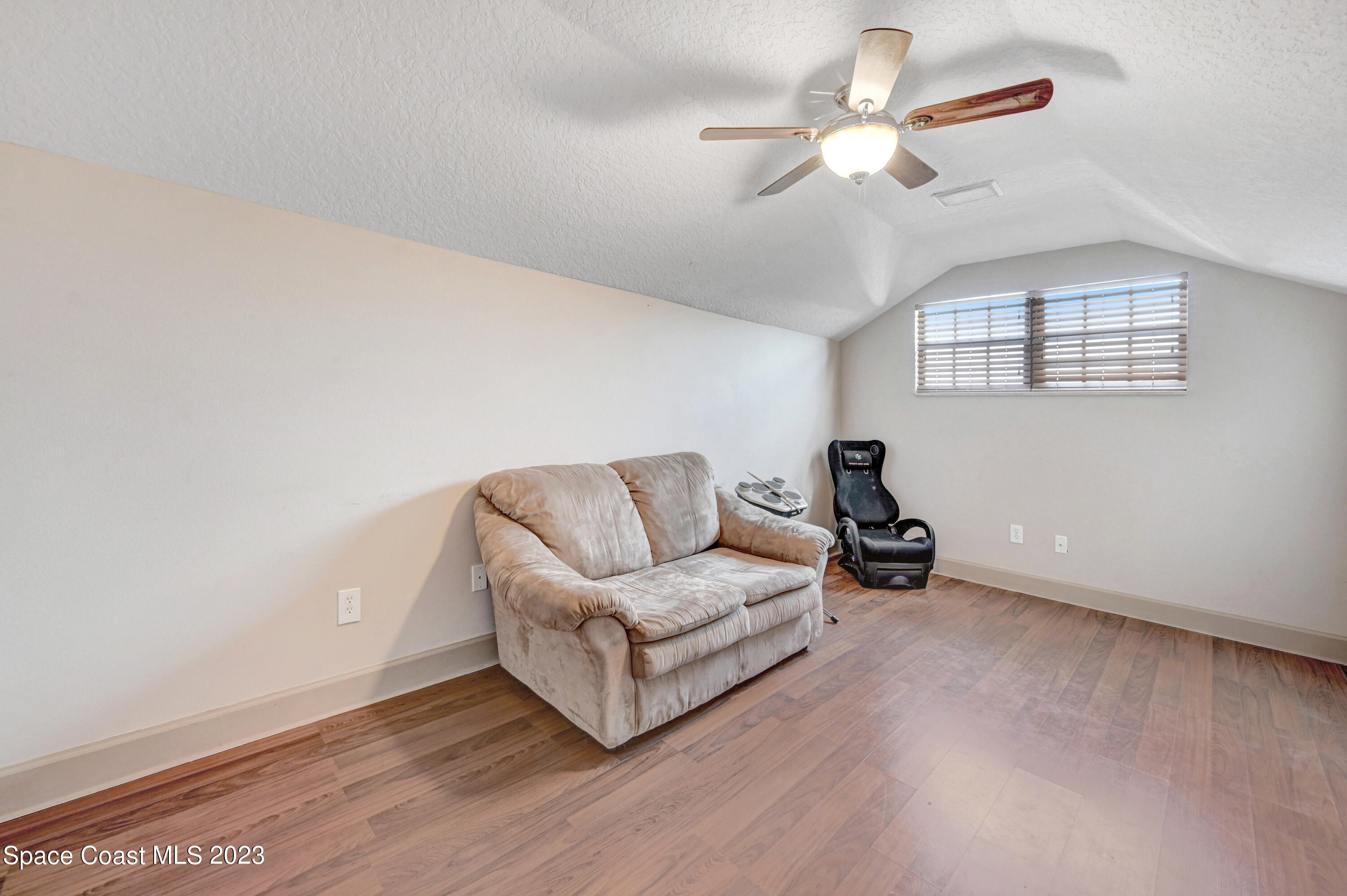 1317 Centennial Way Rockledge, FL 32955 - Photo 31 of 38 a living room with furniture and a ceiling fan