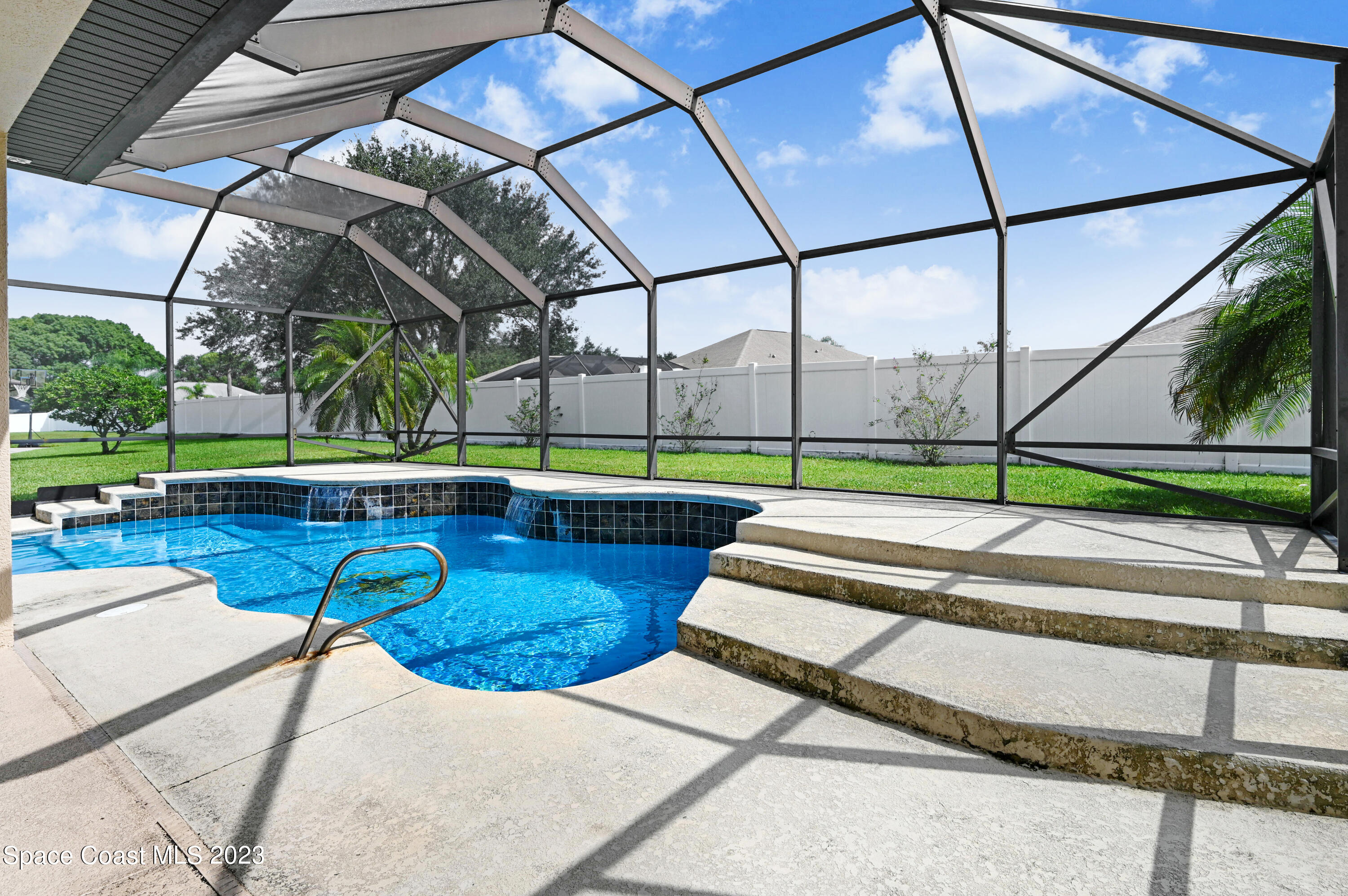 1317 Centennial Way Rockledge, FL 32955 - Photo 32 of 38 a view of yard with a table and chairs