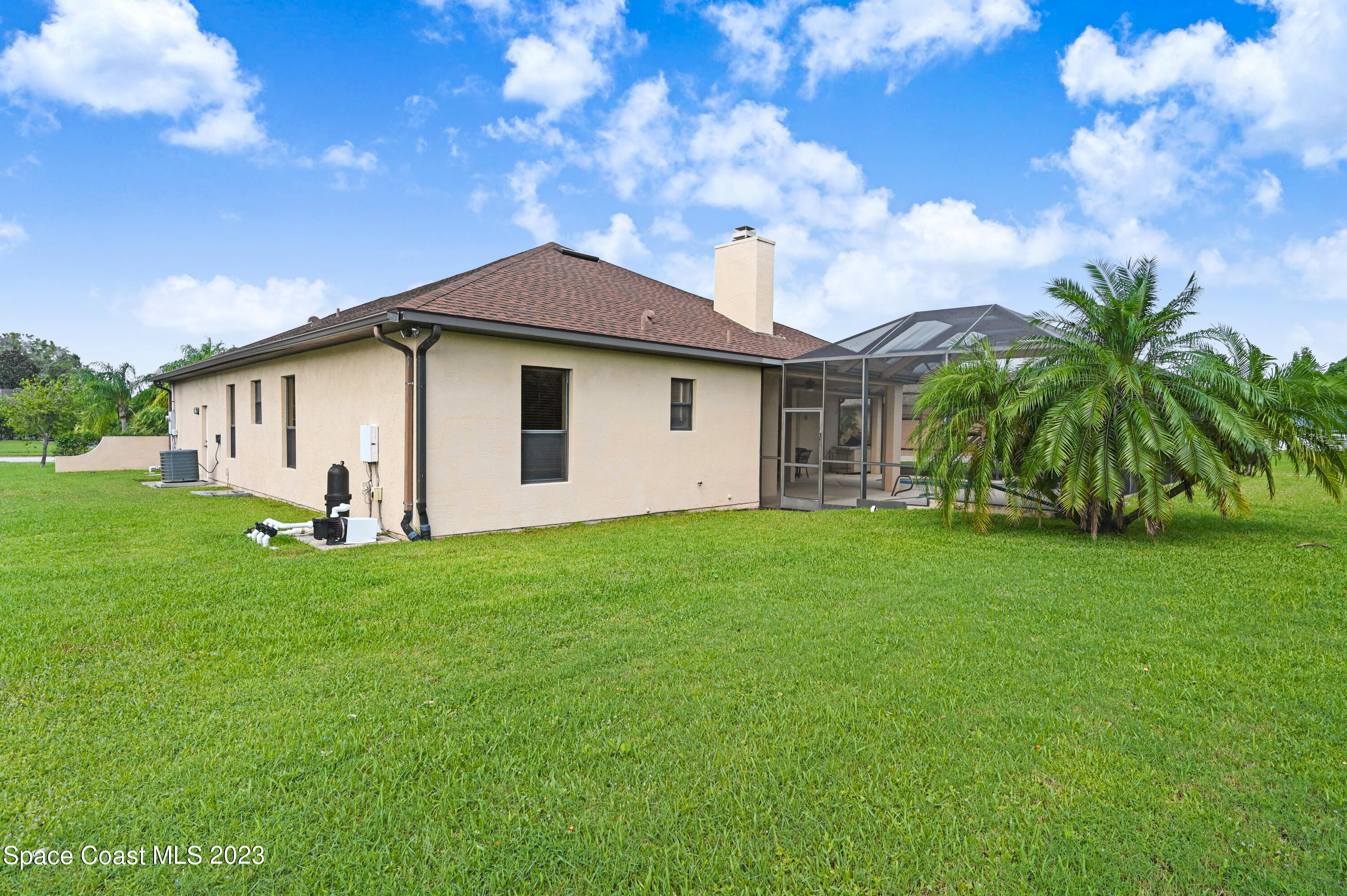 1317 Centennial Way Rockledge, FL 32955 - Photo 33 of 38 a view of a house with backyard and garden