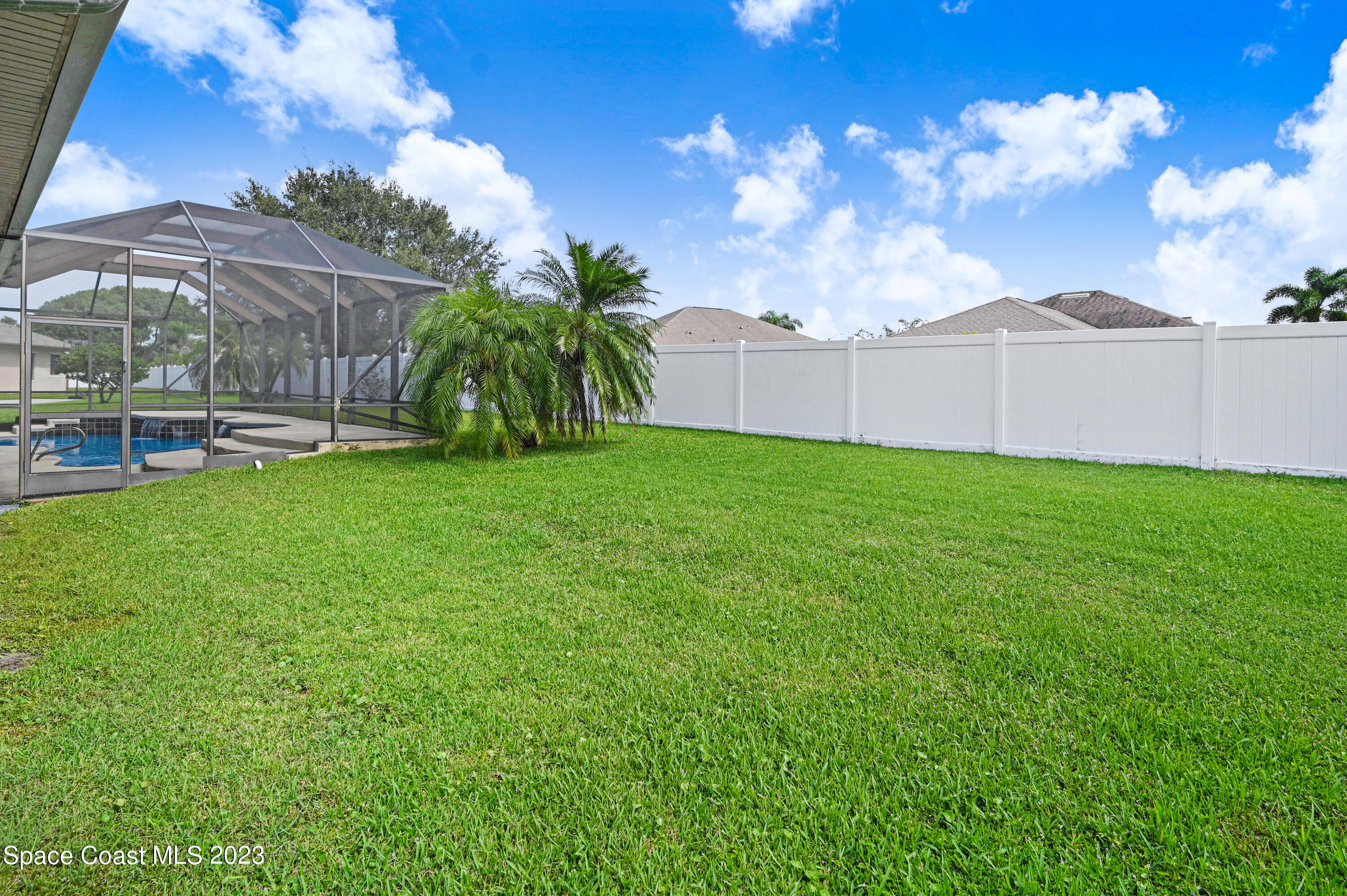 1317 Centennial Way Rockledge, FL 32955 - Photo 34 of 38 a view of a backyard with kitchen