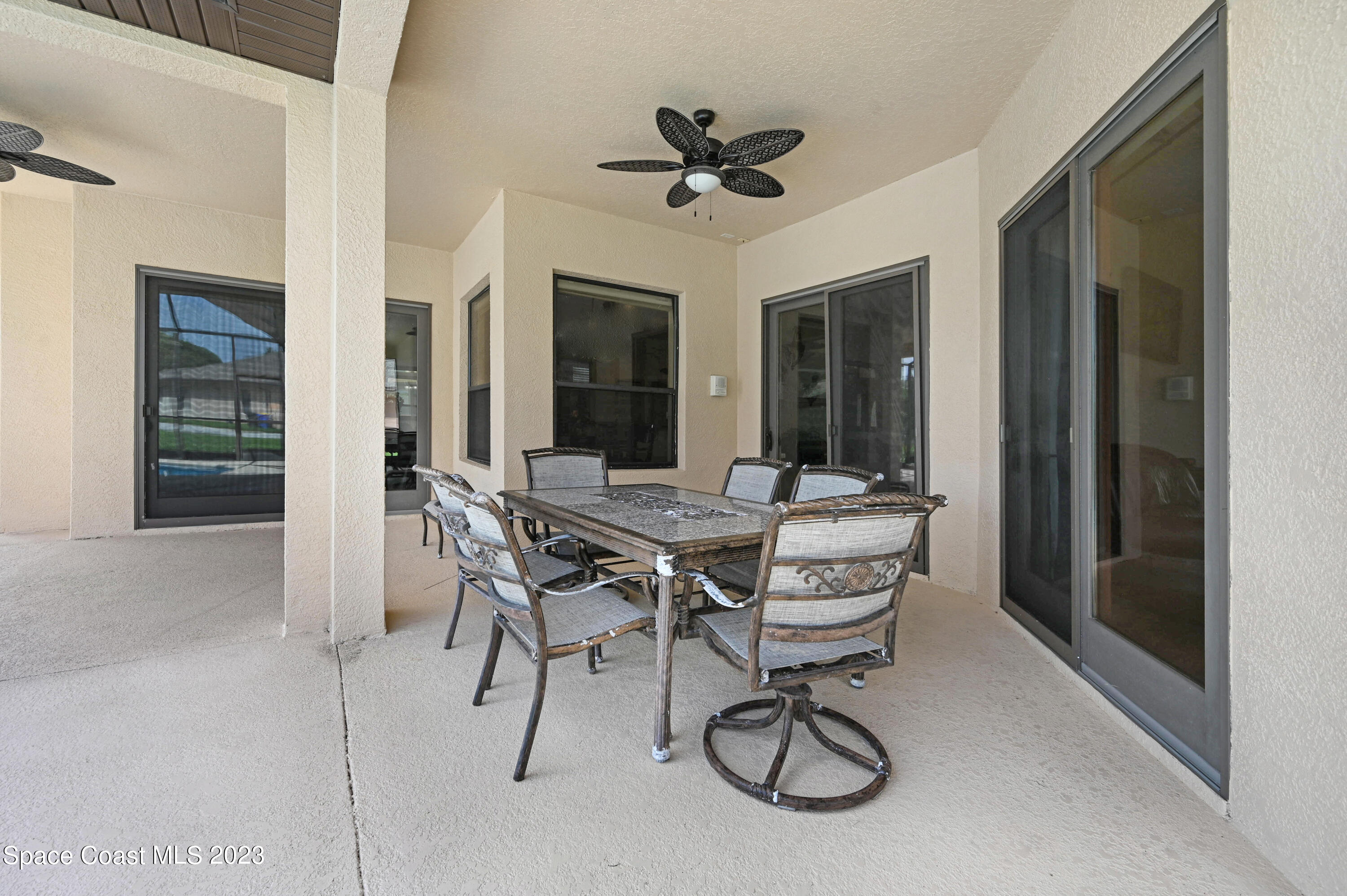 1317 Centennial Way Rockledge, FL 32955 - Photo 36 of 38 a view of a dining room with furniture window and wooden floor
