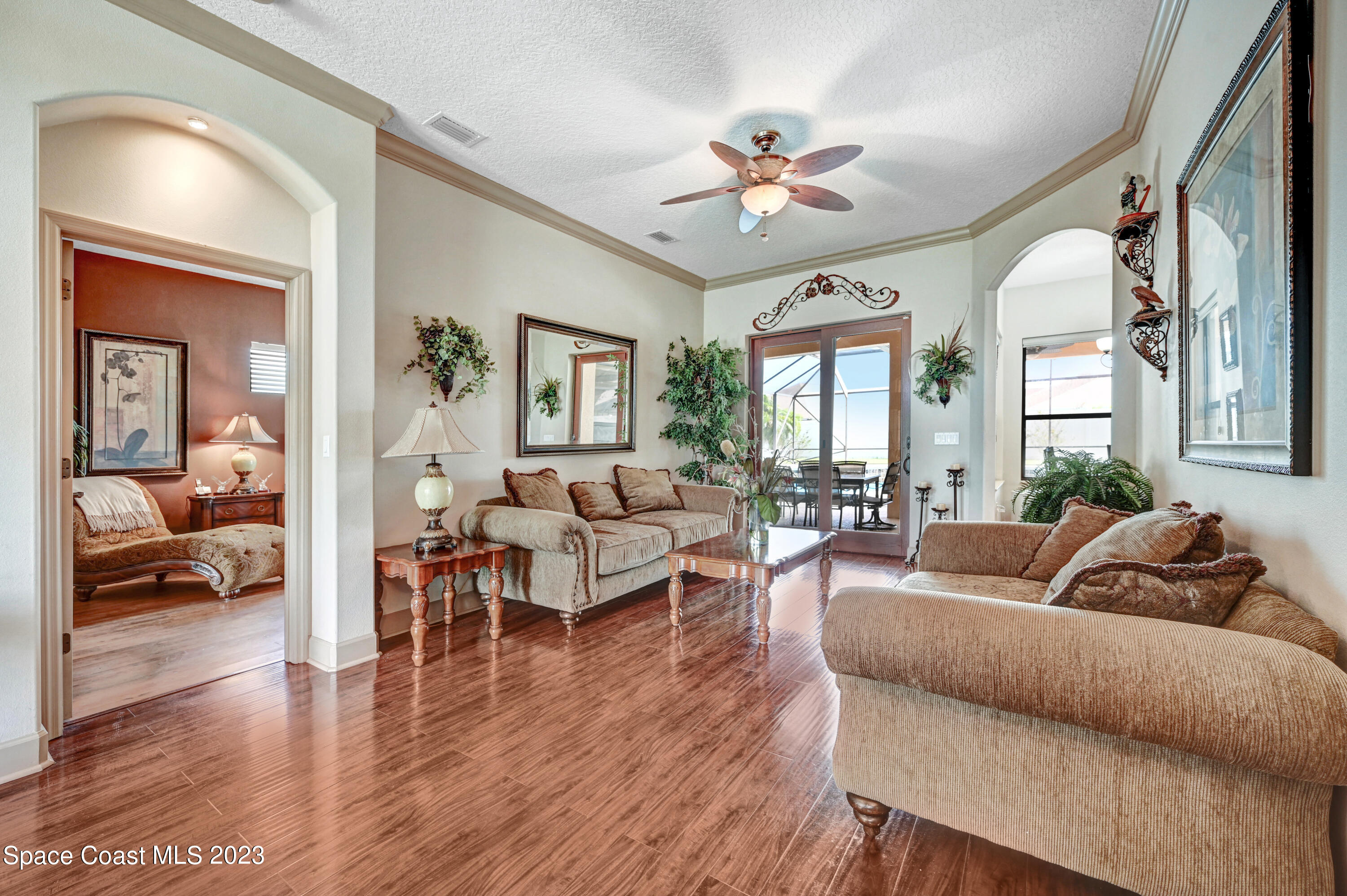 1317 Centennial Way Rockledge, FL 32955 - Photo 4 of 38 a living room with furniture and a large window