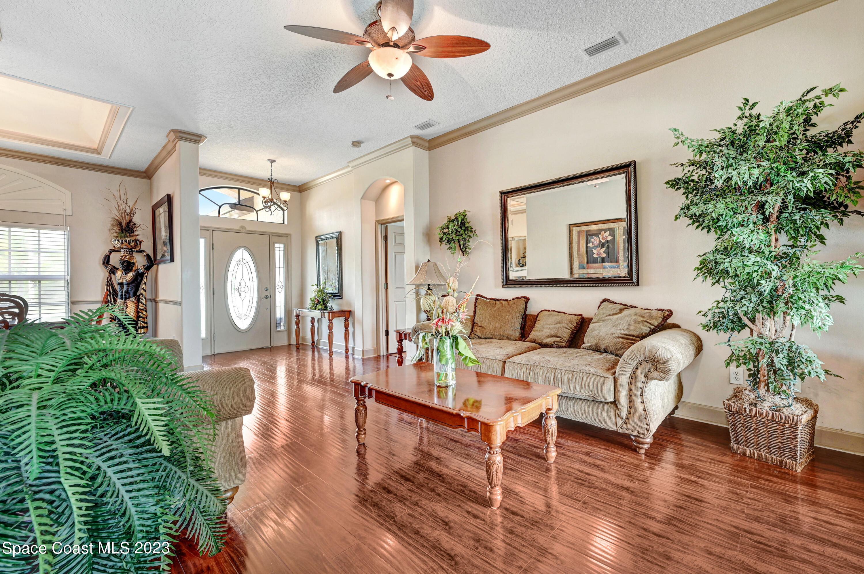 1317 Centennial Way Rockledge, FL 32955 - Photo 5 of 38 a living room with furniture and a large window