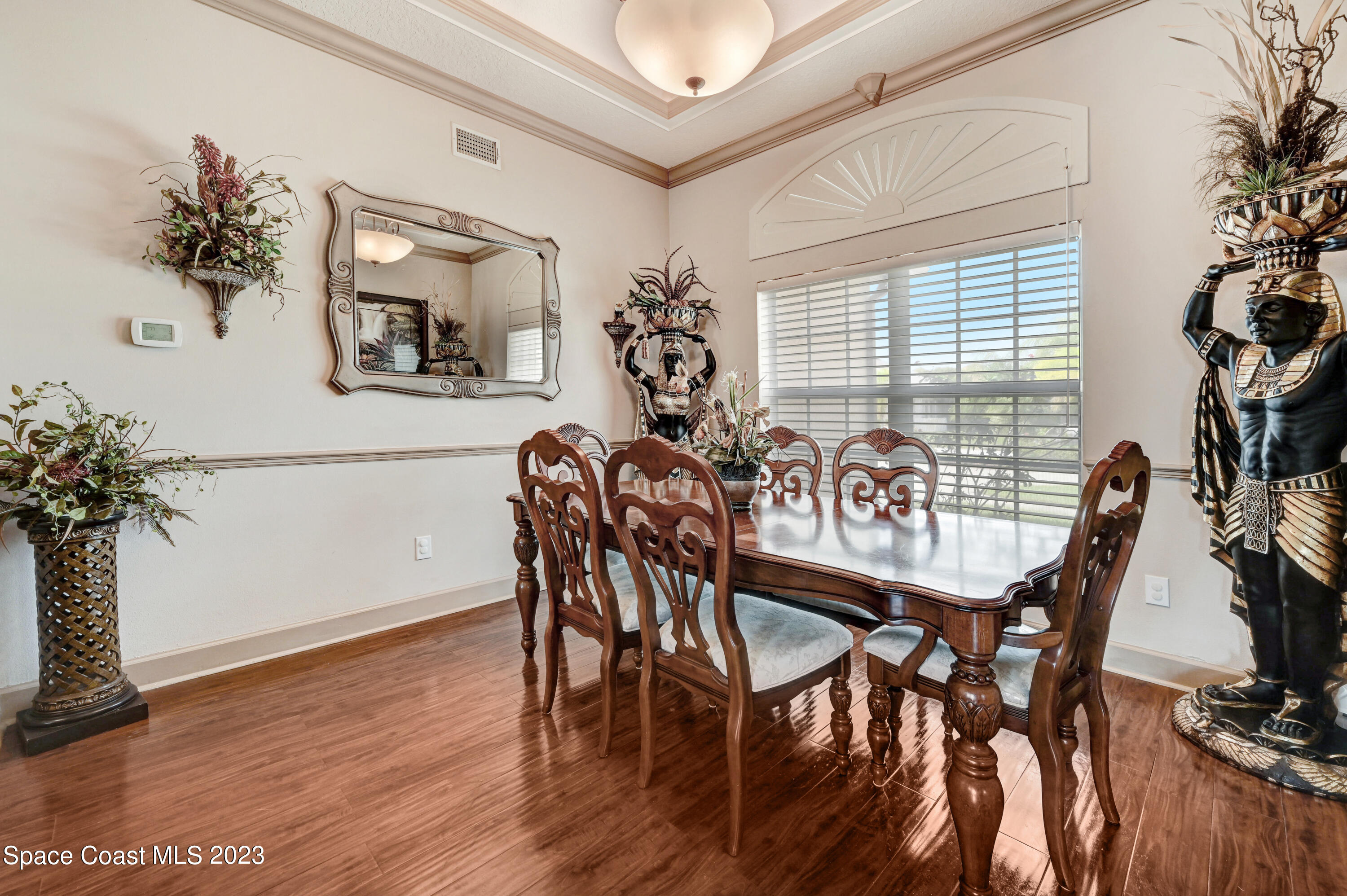 1317 Centennial Way Rockledge, FL 32955 - Photo 6 of 38 a view of a dining room with furniture and wooden floor