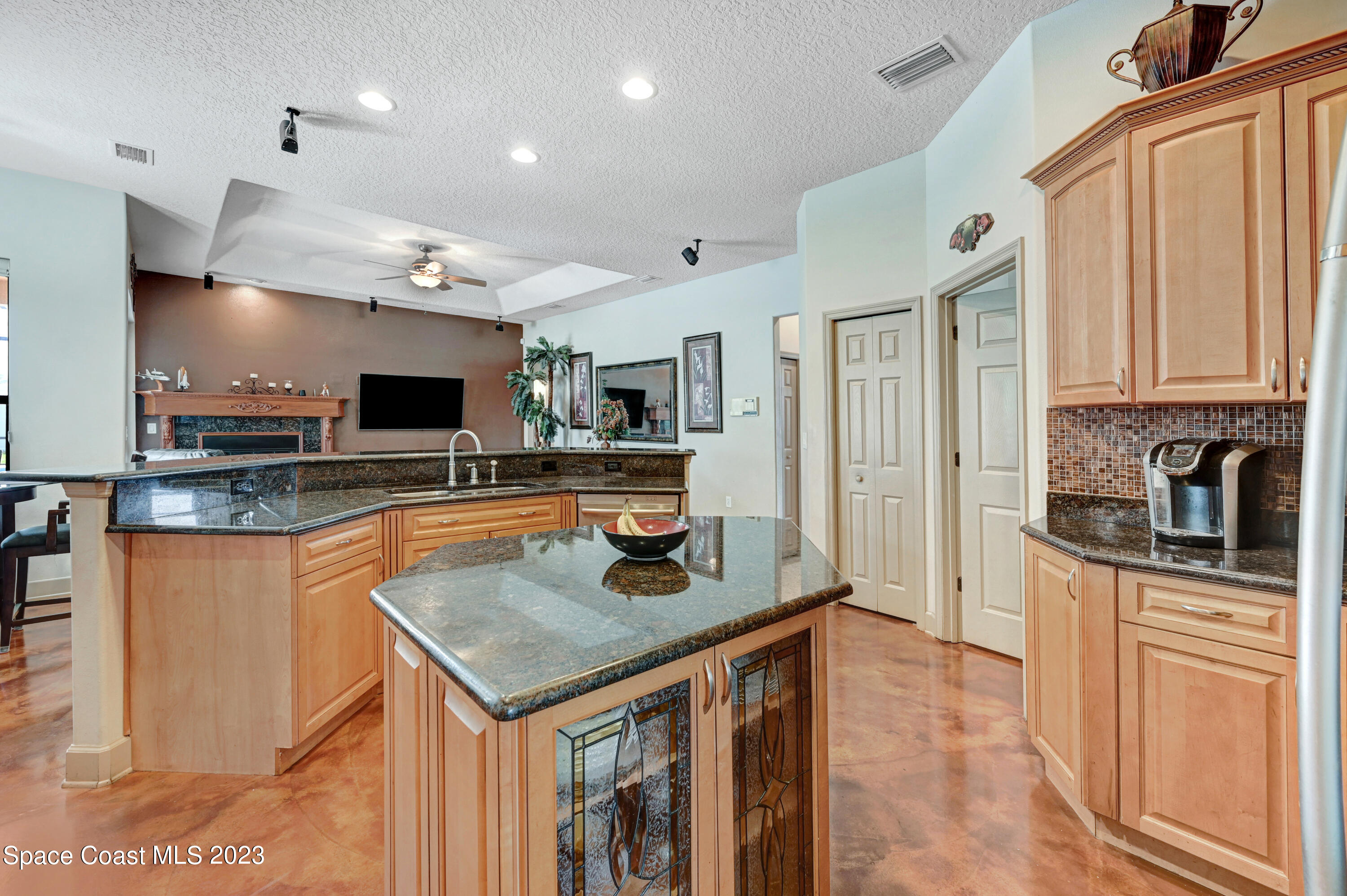 1317 Centennial Way Rockledge, FL 32955 - Photo 8 of 38 a kitchen with stainless steel appliances granite countertop a sink stove and refrigerator