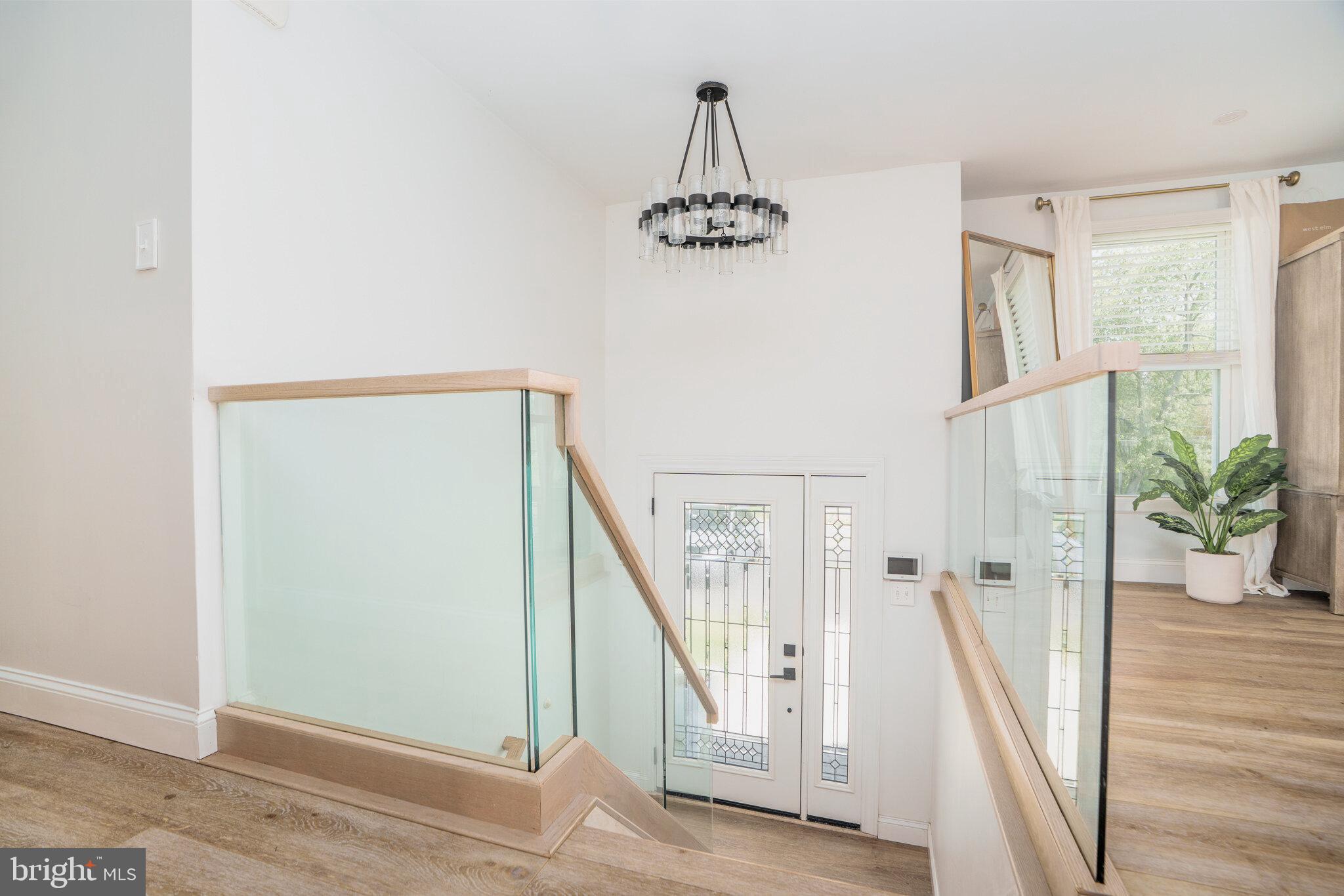 1 Highview Road Conowingo, MD 21918 - Photo 19 of 36 Stairway landing with modern glass railing