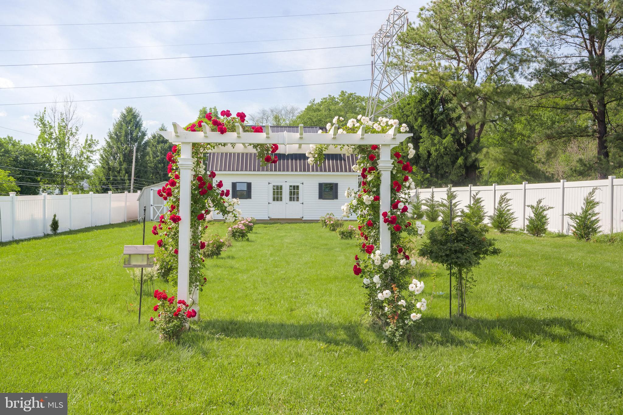 1 Highview Road Conowingo, MD 21918 - Photo 3 of 36 Landscaped backyard with decorative garden arbor