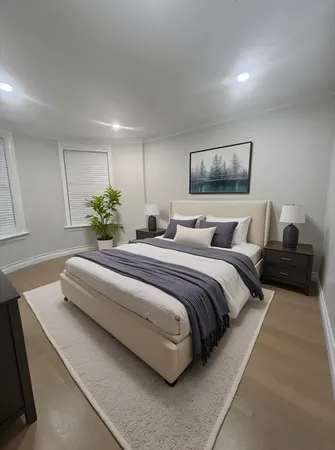 a bedroom with a large bed and a couch