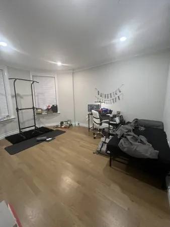 a room with gym equipment and a large window