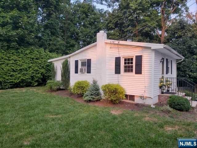 295 Lincoln Avenue Ridgewood, NJ 07450 - Photo 1 of 17 a front view of a house with garden