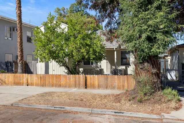 front view of a house with a tree