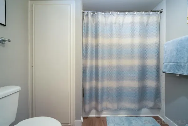 a bathroom with a glass shower door